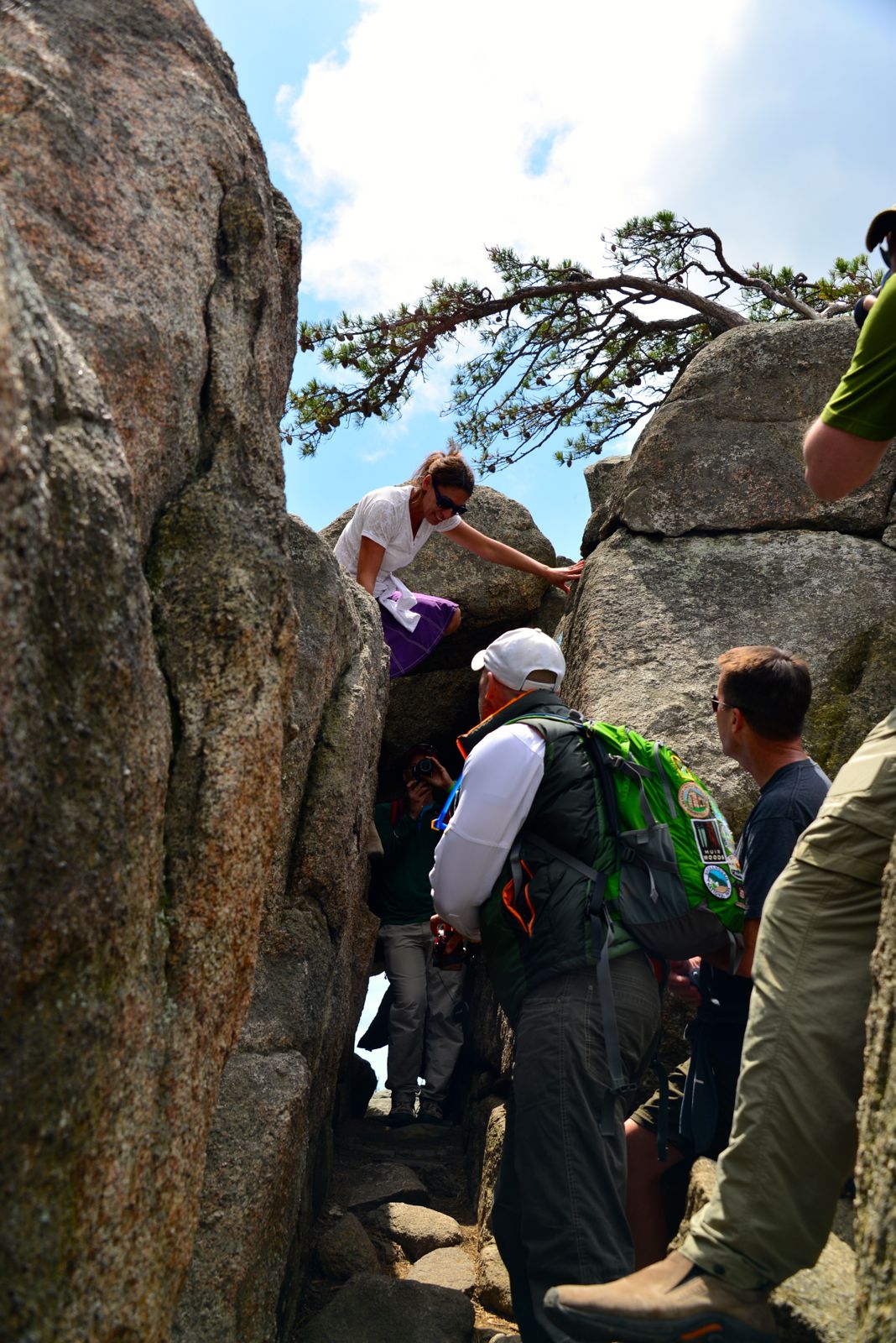 All the boys are standing around watching.../