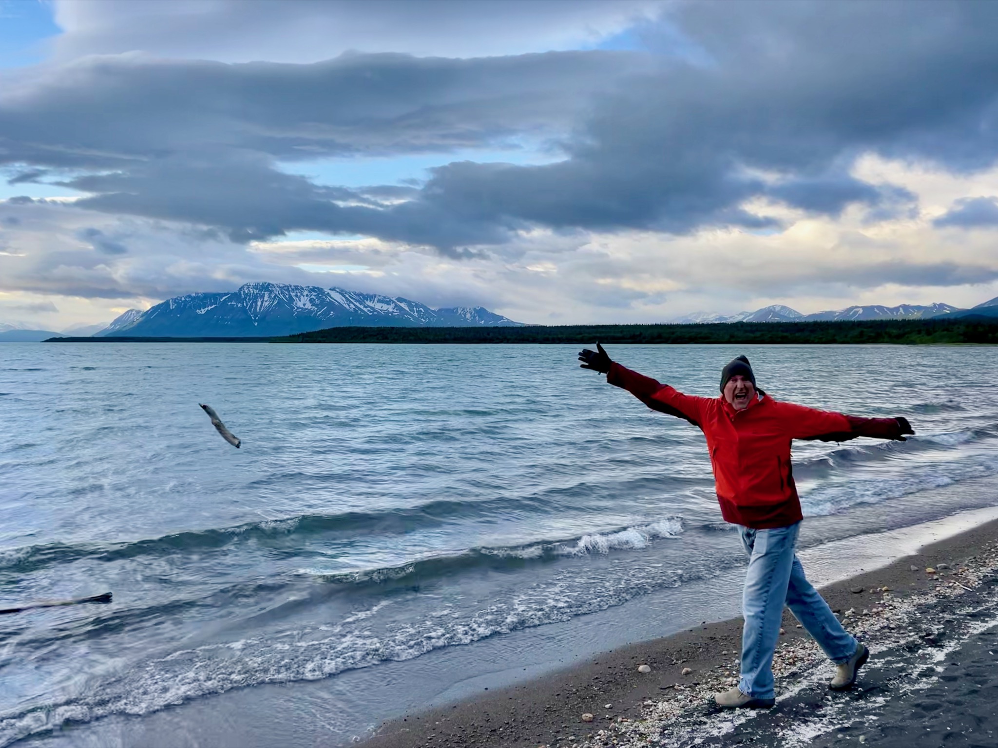 Dan throwing his stick in the water /