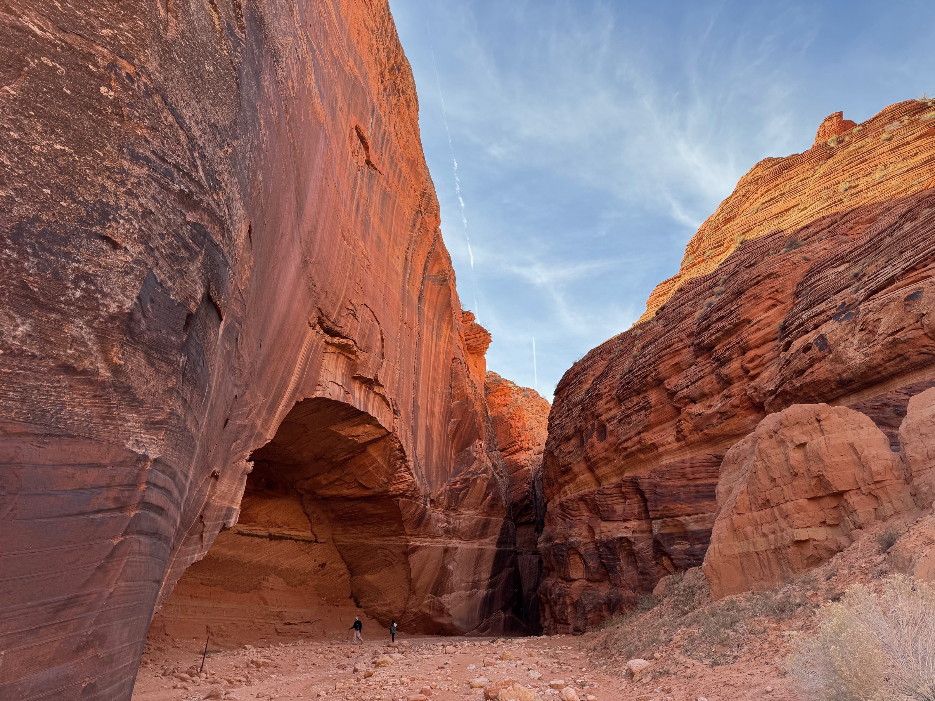 Petroglyph wall with people for scale/