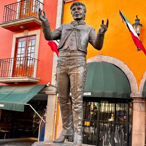 Gay mezcal dude statue/
		    