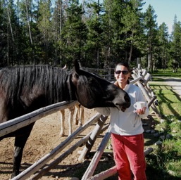 Assana's new buddy trying to drink her tea/
		    