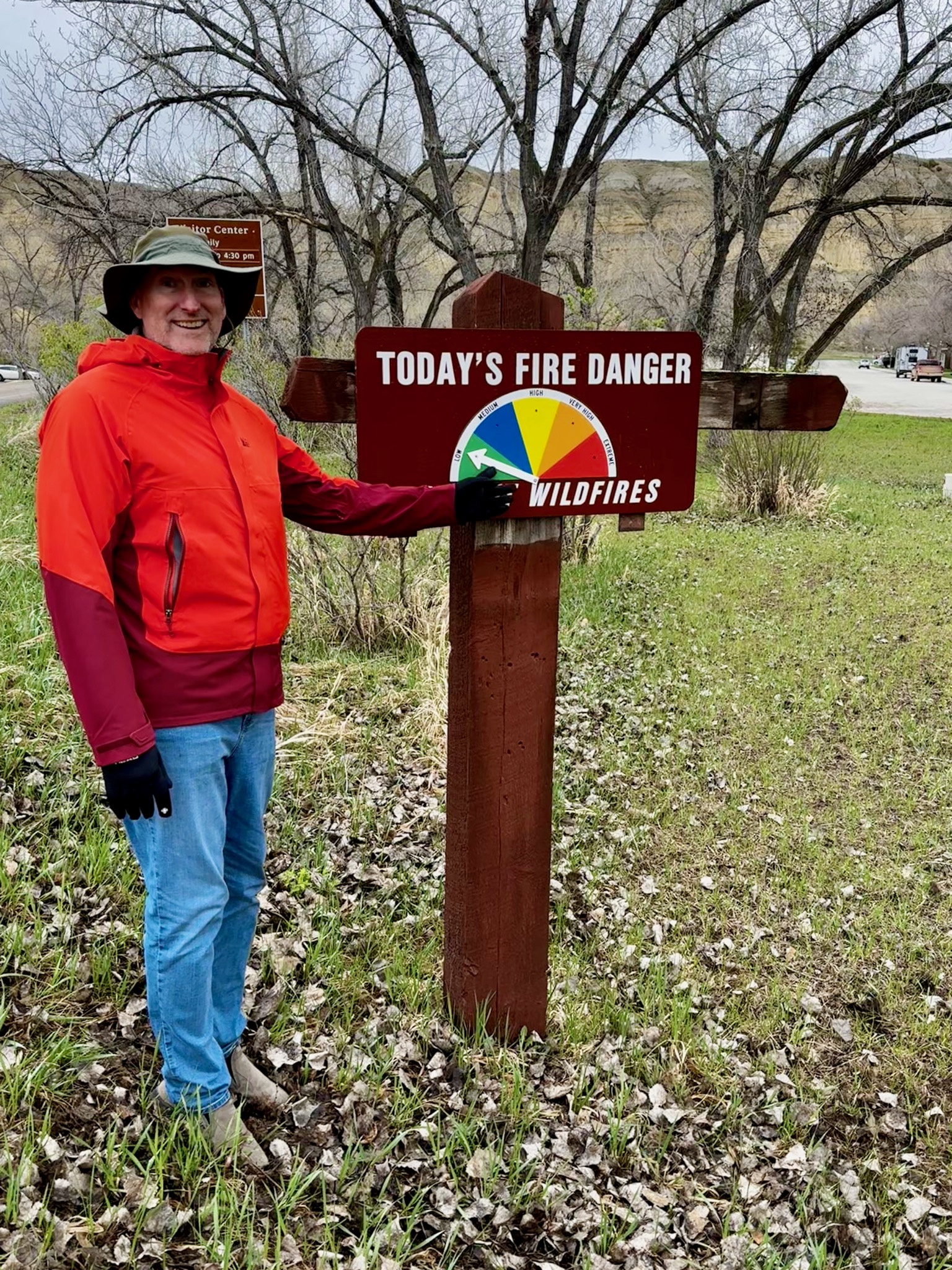 Dan messing with the moderate fire danger as we soak in the rain/201 Main St, Medora, ND 58645, USA
