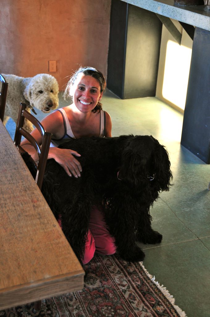 Sophia trying to fit all of her 80lbs on Assana's lap/