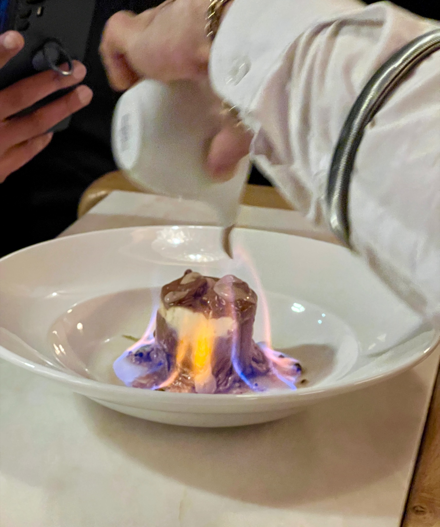 ... and fancy dessert set on fire/R. de Santiago 12, 1100-494 Lisboa, Portugal