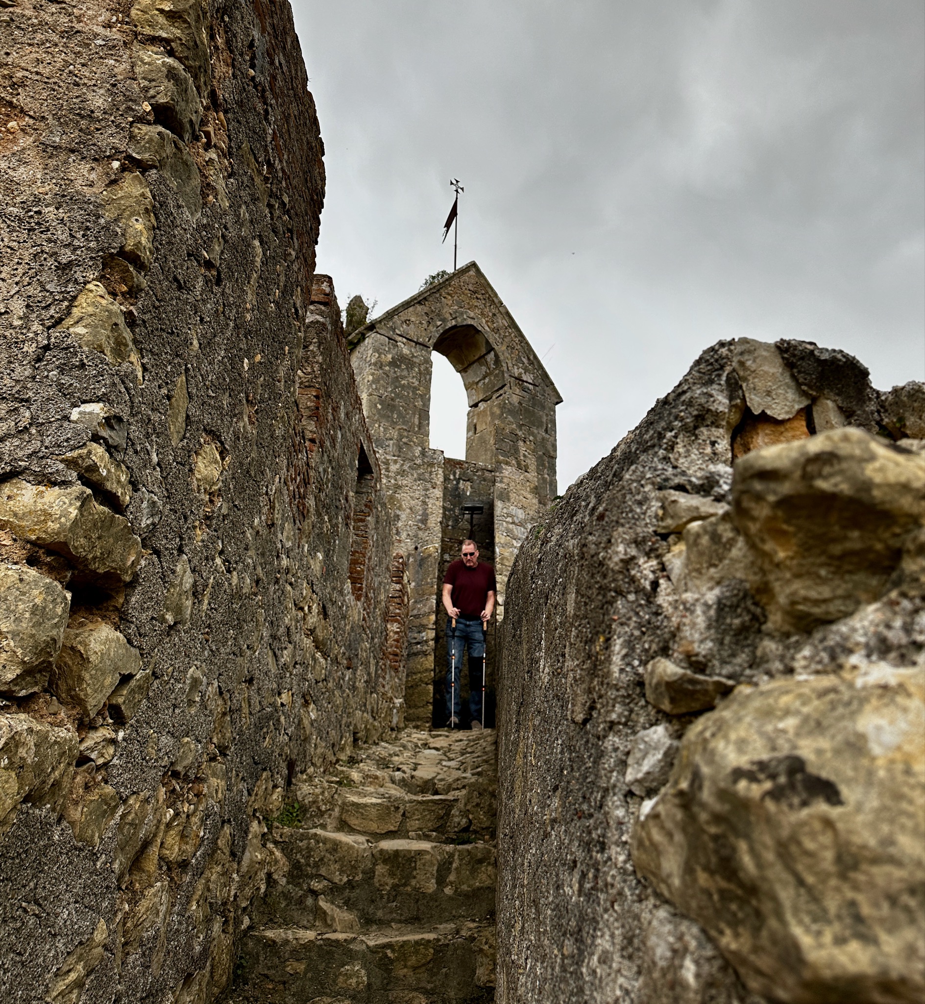 Dan braving the narrow stone stairs in Castelo de Tomar/Estr. do Convento 8 2300, 2300 Tomar, Portugal