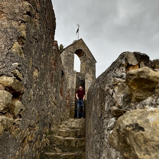 Dan braving the narrow stone stairs in Castelo de Tomar/
		    Estr. do Convento 8 2300, 2300 Tomar, Portugal