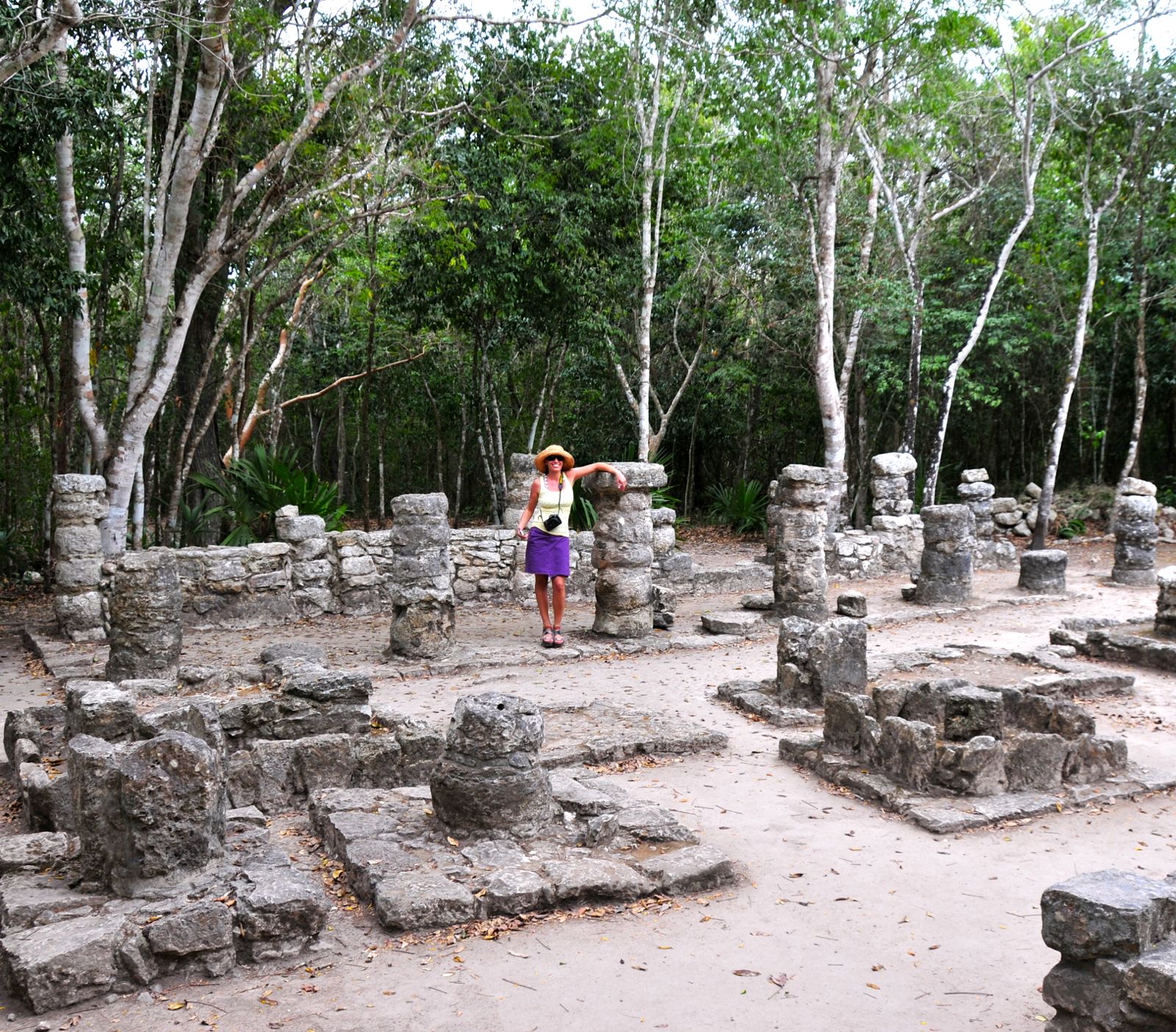 Assana with her arm on the walkway's roof; the Mayans were tiny people!/