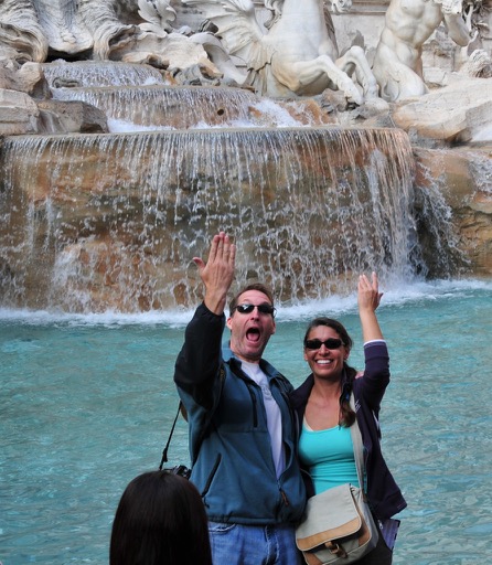 Coin toss in Trevi fountain - Rome, Italy