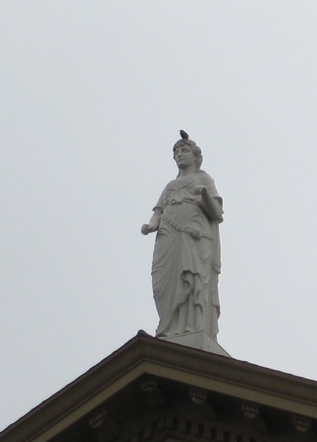 Little birdie keeping the statue company/